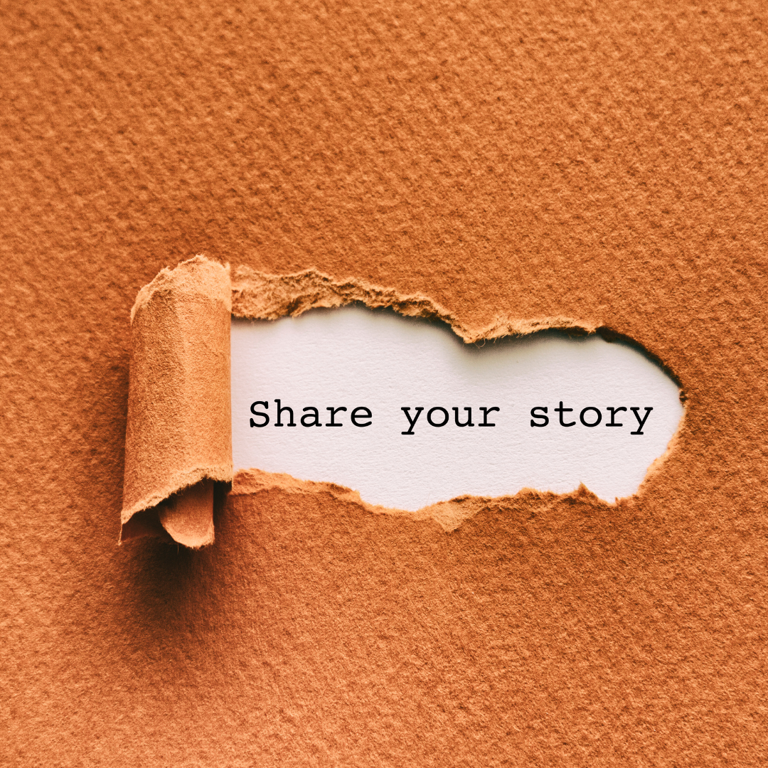 A teared up part of an orange paper to reveal the words "Share your story" on a white paper
