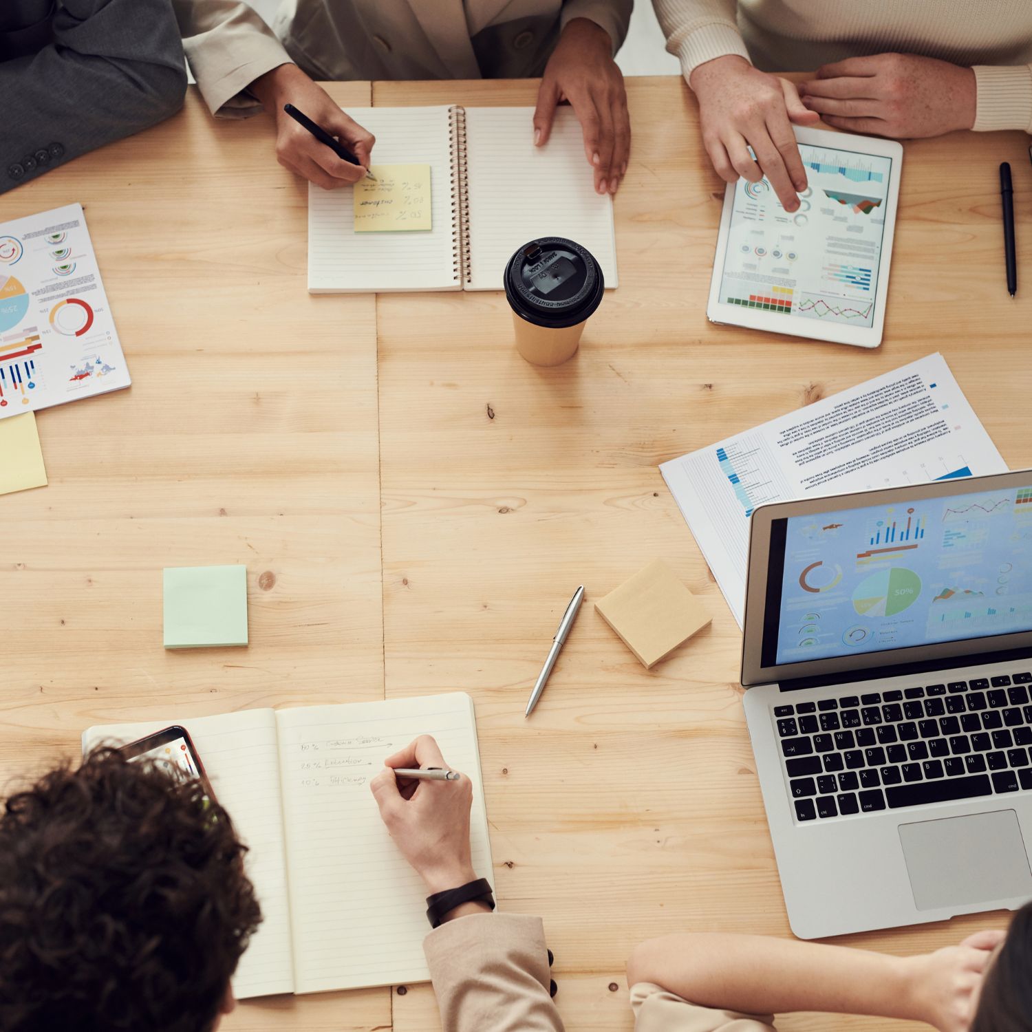 Picture of desk with team working
