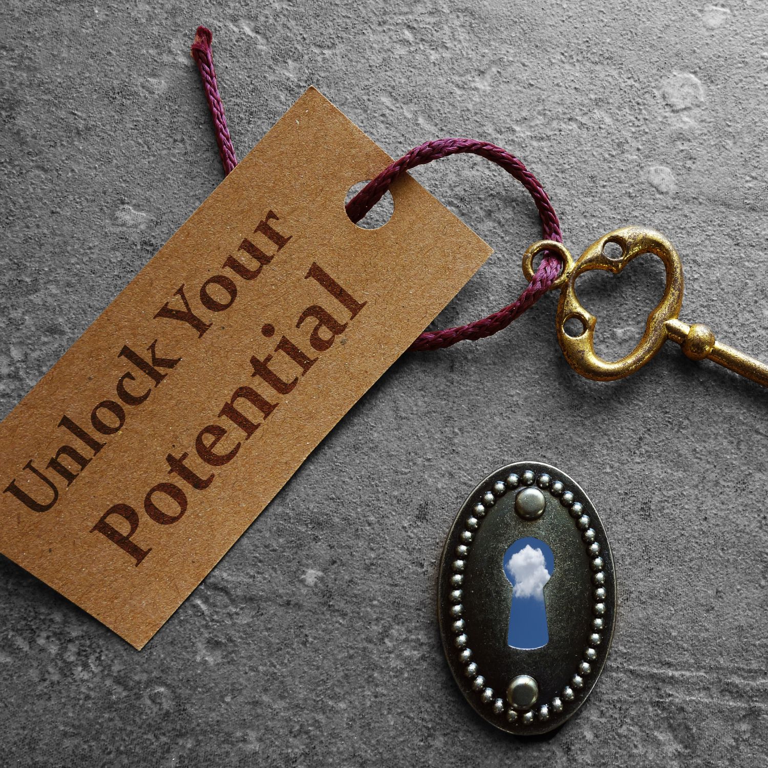 A key with a tag that says "Unlock your potential" and a keyhole shows the sky
